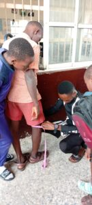 Pupils in classroom recording a thank-you video to SHINE